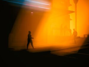 Silhouetted people walking on the street - Cyberpunk 2077