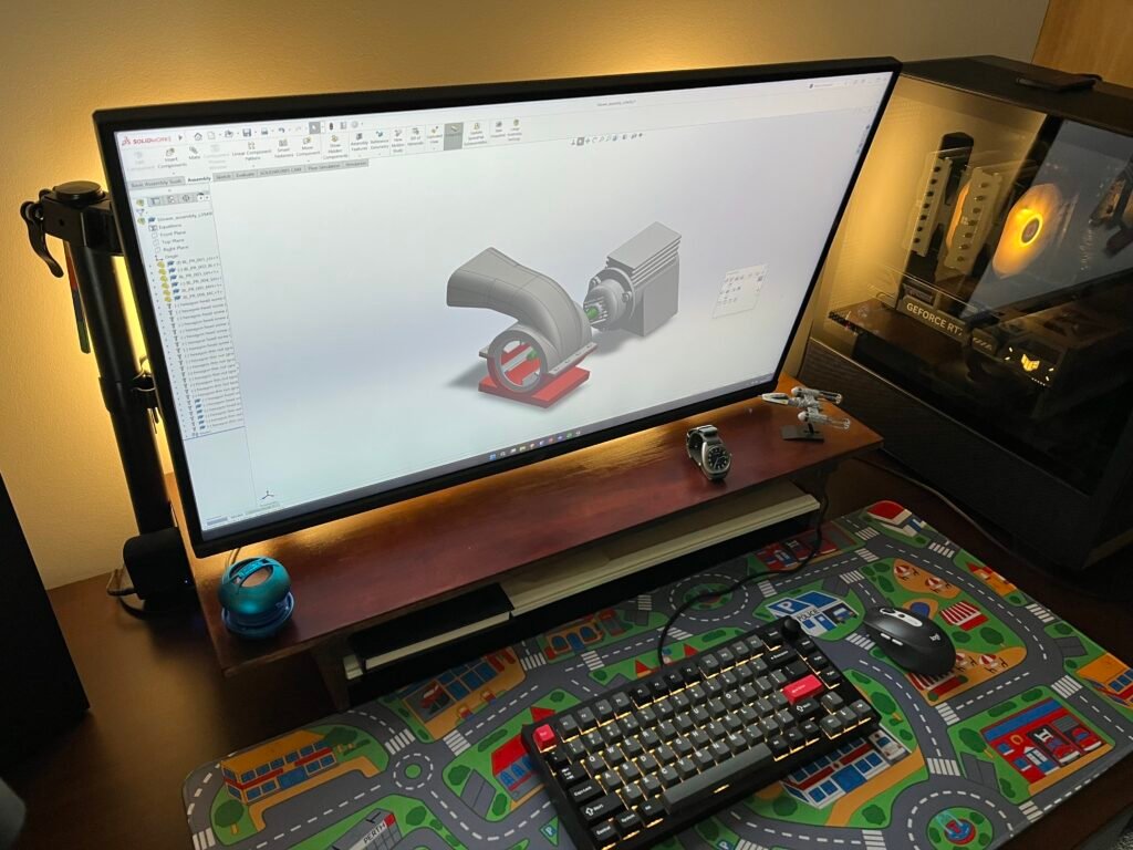 overhead view of wooden monitor riser on desk